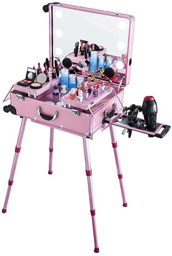 large pink cosmetic and hairdressing case full of cosmetics