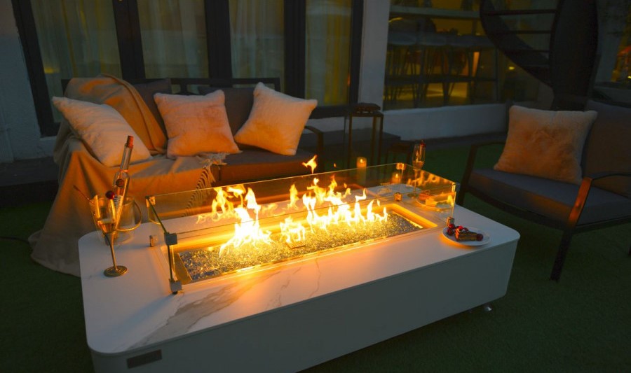 Gas fireplace in a luxurious white marble table