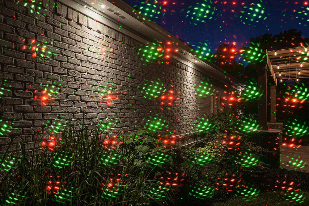 laser light projection on the house wall garden 