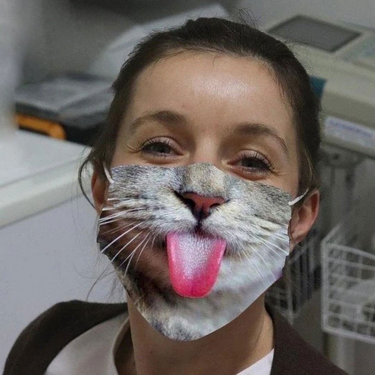mask on the face kitten with tongue