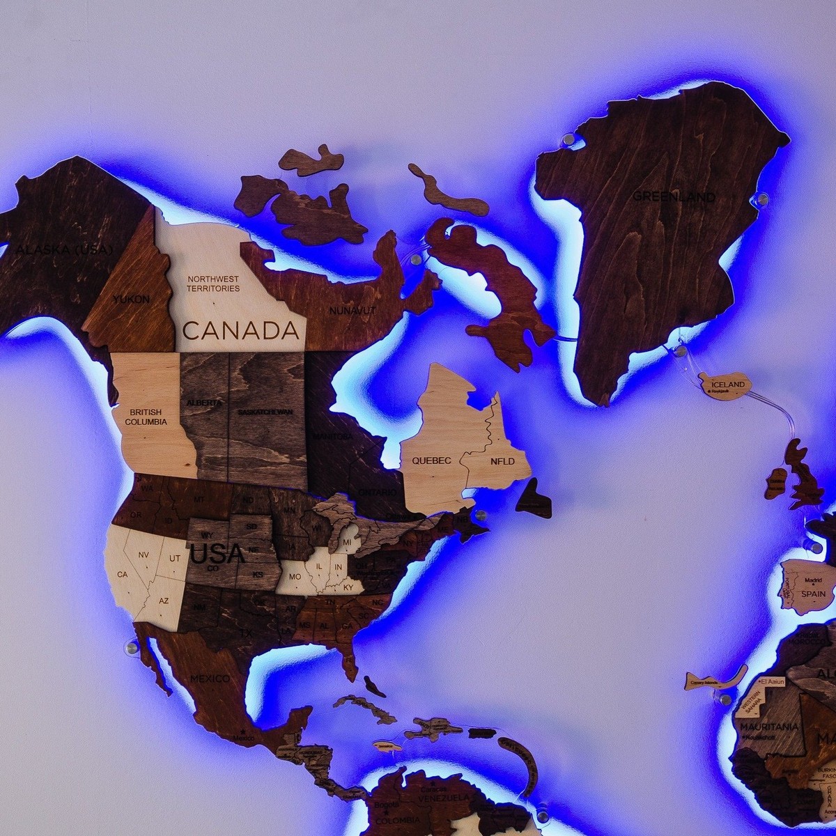 backlit wooden world map on a wall