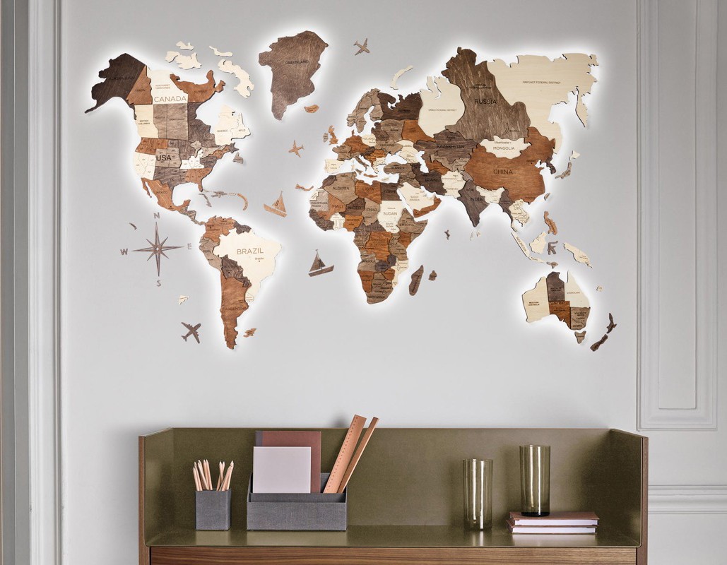 hand-colored 3D world map on the wall