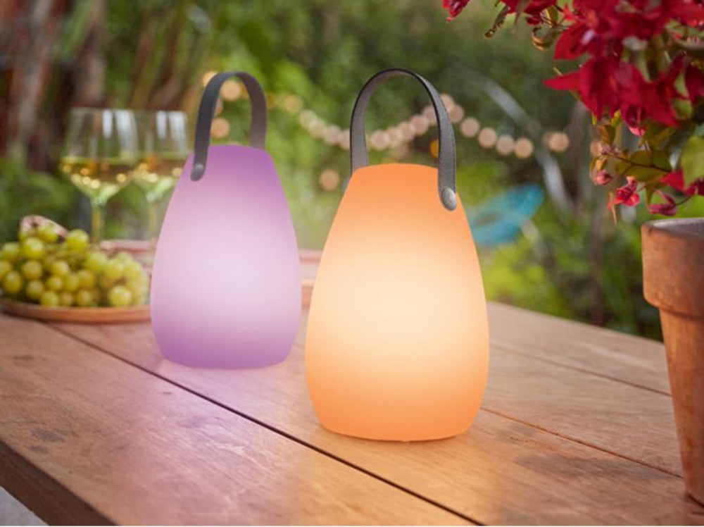 colored table lamp into garden