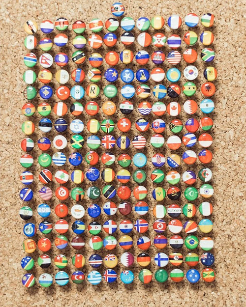 map made of wood push pins flags